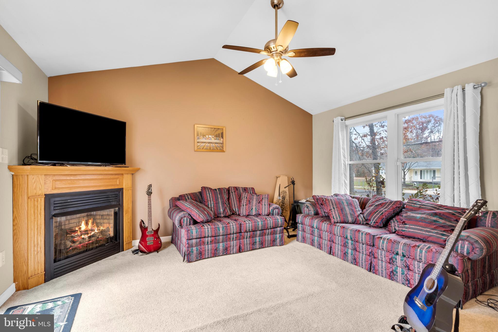 470 Wilson Avenue Lindenwold, NJ 08021 - Photo 6 of 38 a living room with furniture fireplace and flat screen tv