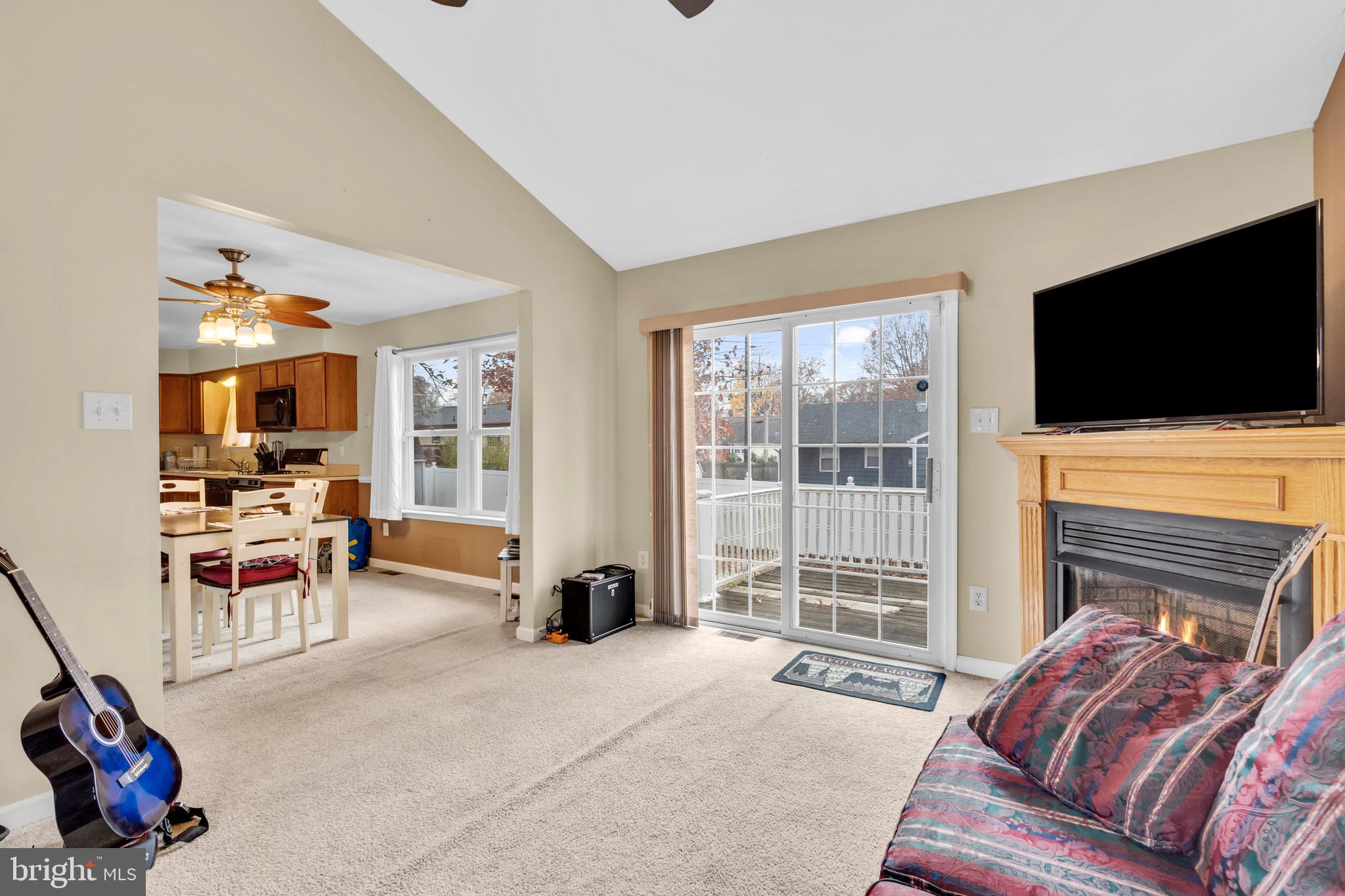 470 Wilson Avenue Lindenwold, NJ 08021 - Photo 7 of 38 a living room with furniture a flat screen tv and a fireplace