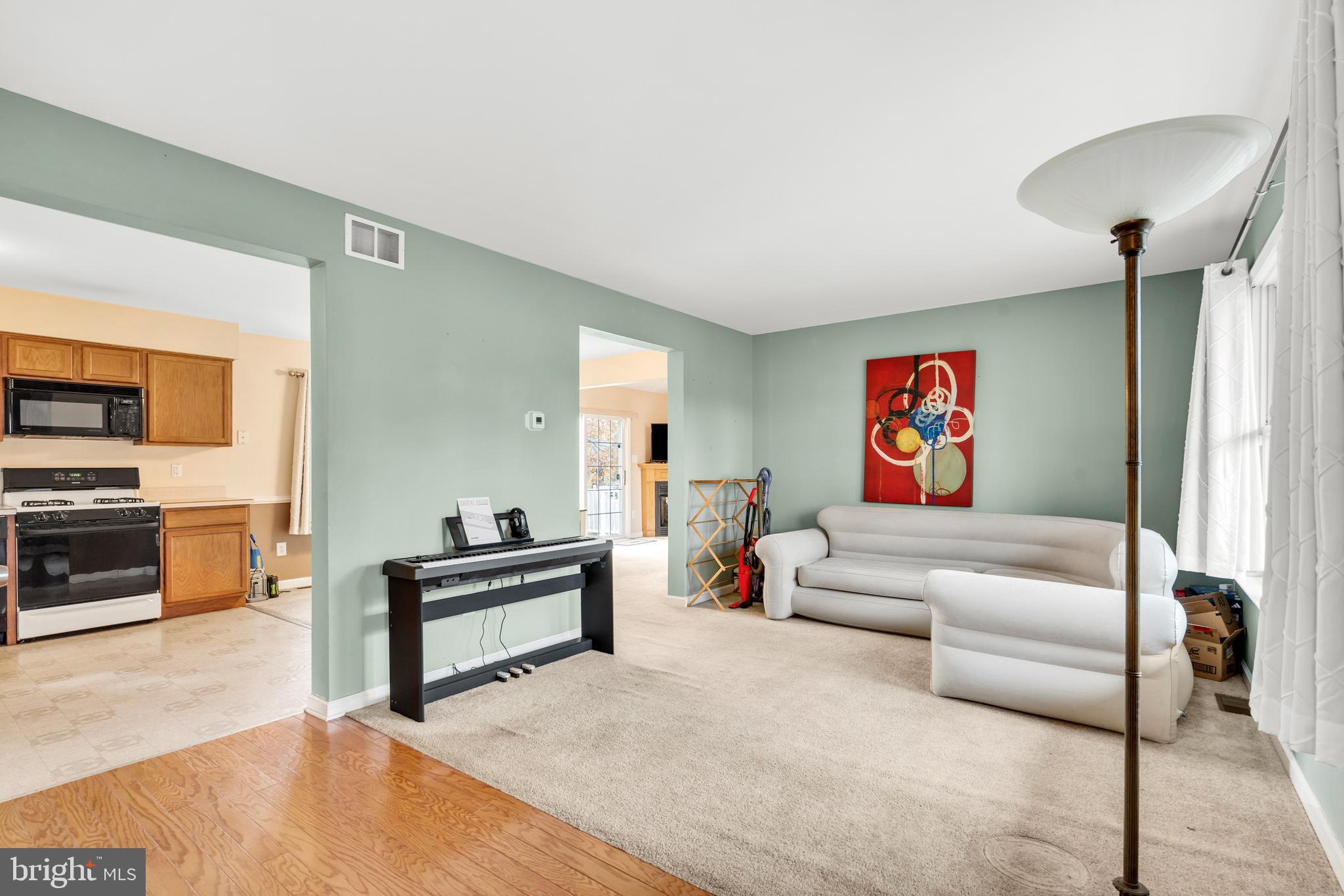 470 Wilson Avenue Lindenwold, NJ 08021 - Photo 8 of 38 a living room with furniture and a fireplace