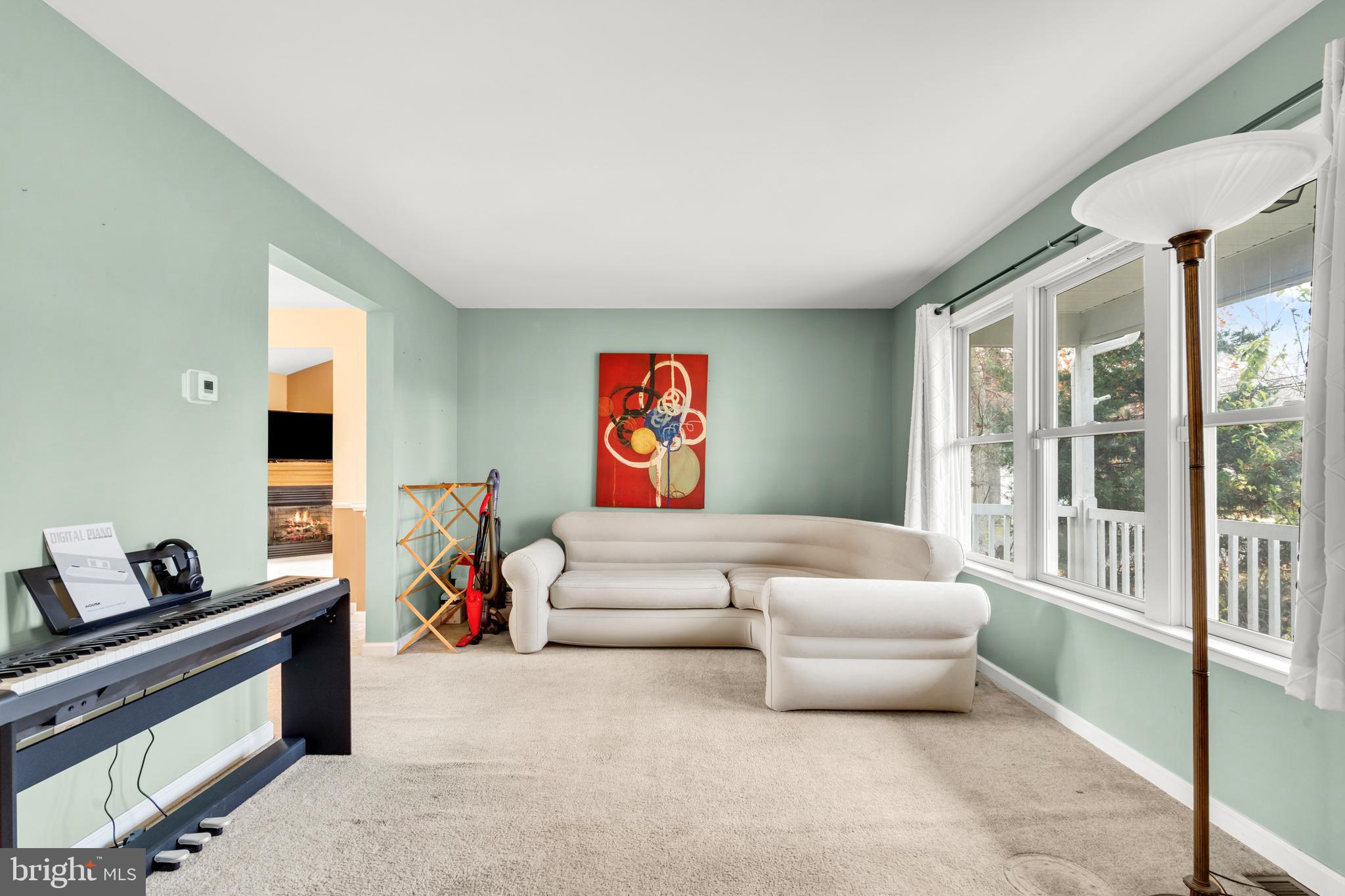470 Wilson Avenue Lindenwold, NJ 08021 - Photo 9 of 38 a living room with furniture and a window