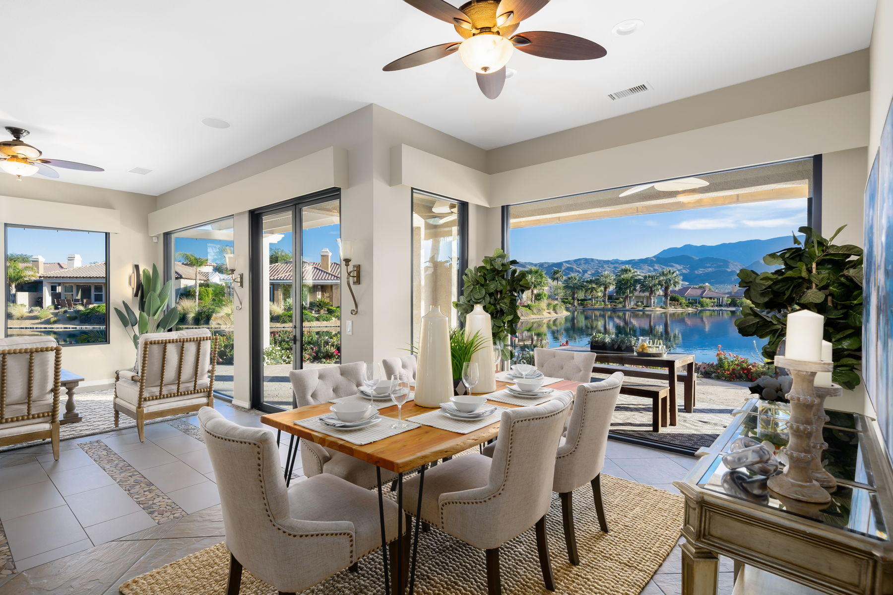 3 Pyramid Lake Court Rancho Mirage, CA 92270 - Photo 11 of 40 a dining room with furniture garden view and a chandelier