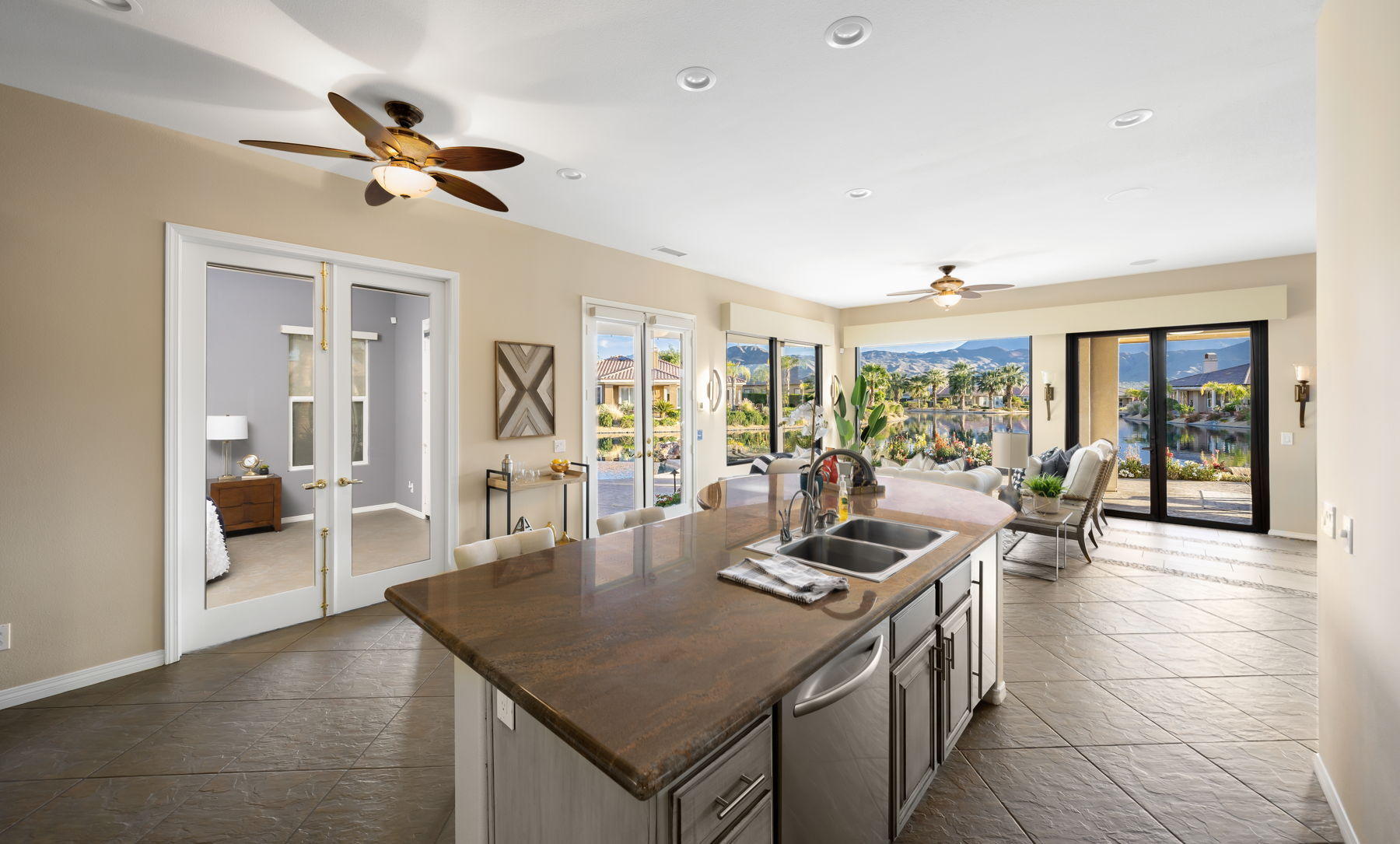 3 Pyramid Lake Court Rancho Mirage, CA 92270 - Photo 18 of 40 a living room with furniture a chandelier and a dining table