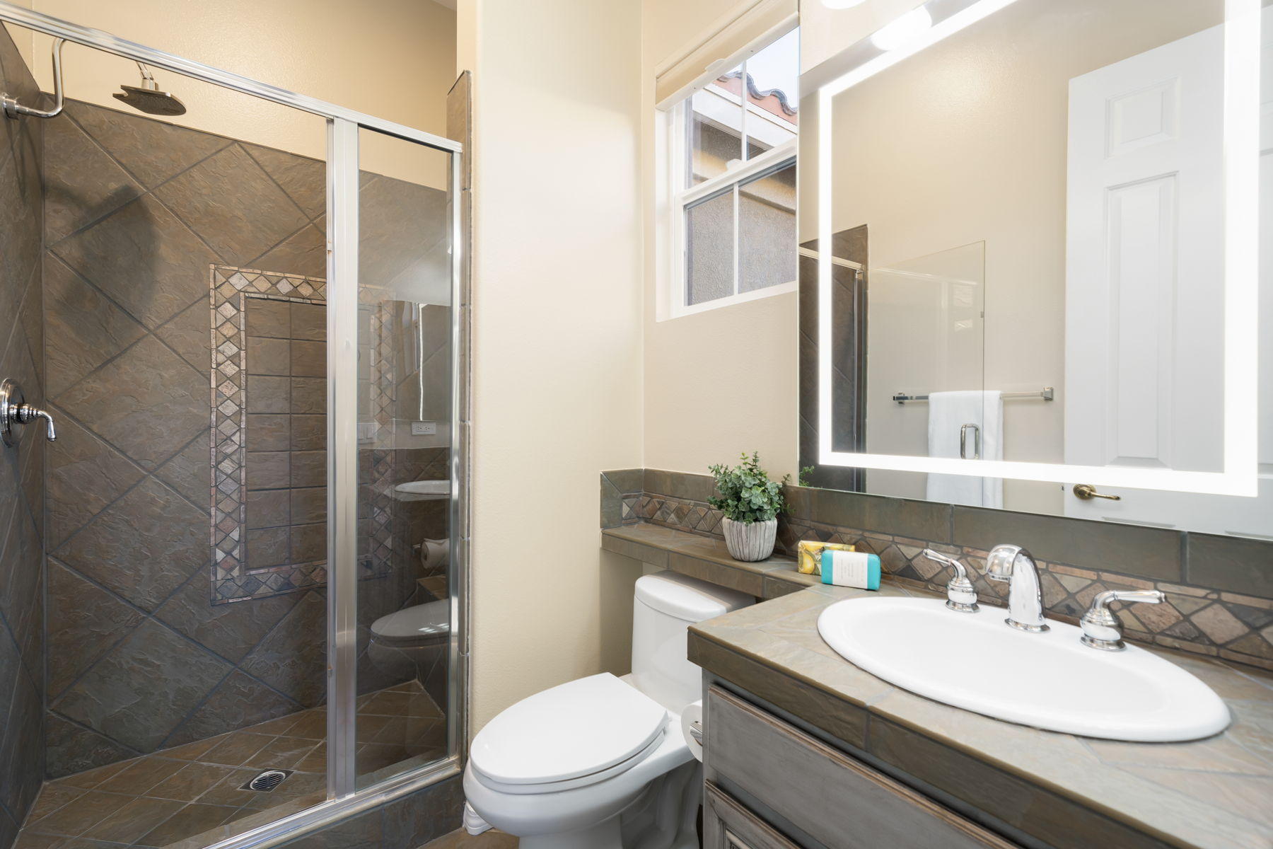 3 Pyramid Lake Court Rancho Mirage, CA 92270 - Photo 23 of 40 a bathroom with a sink toilet and shower