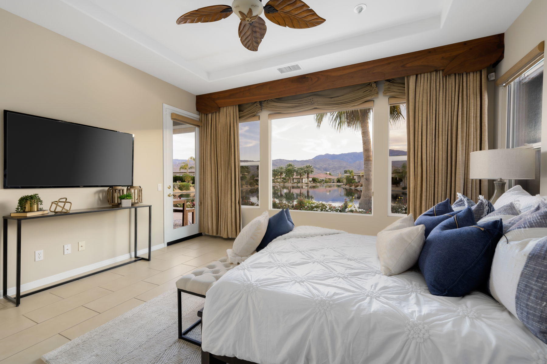 3 Pyramid Lake Court Rancho Mirage, CA 92270 - Photo 27 of 40 a bedroom with a bed and large window