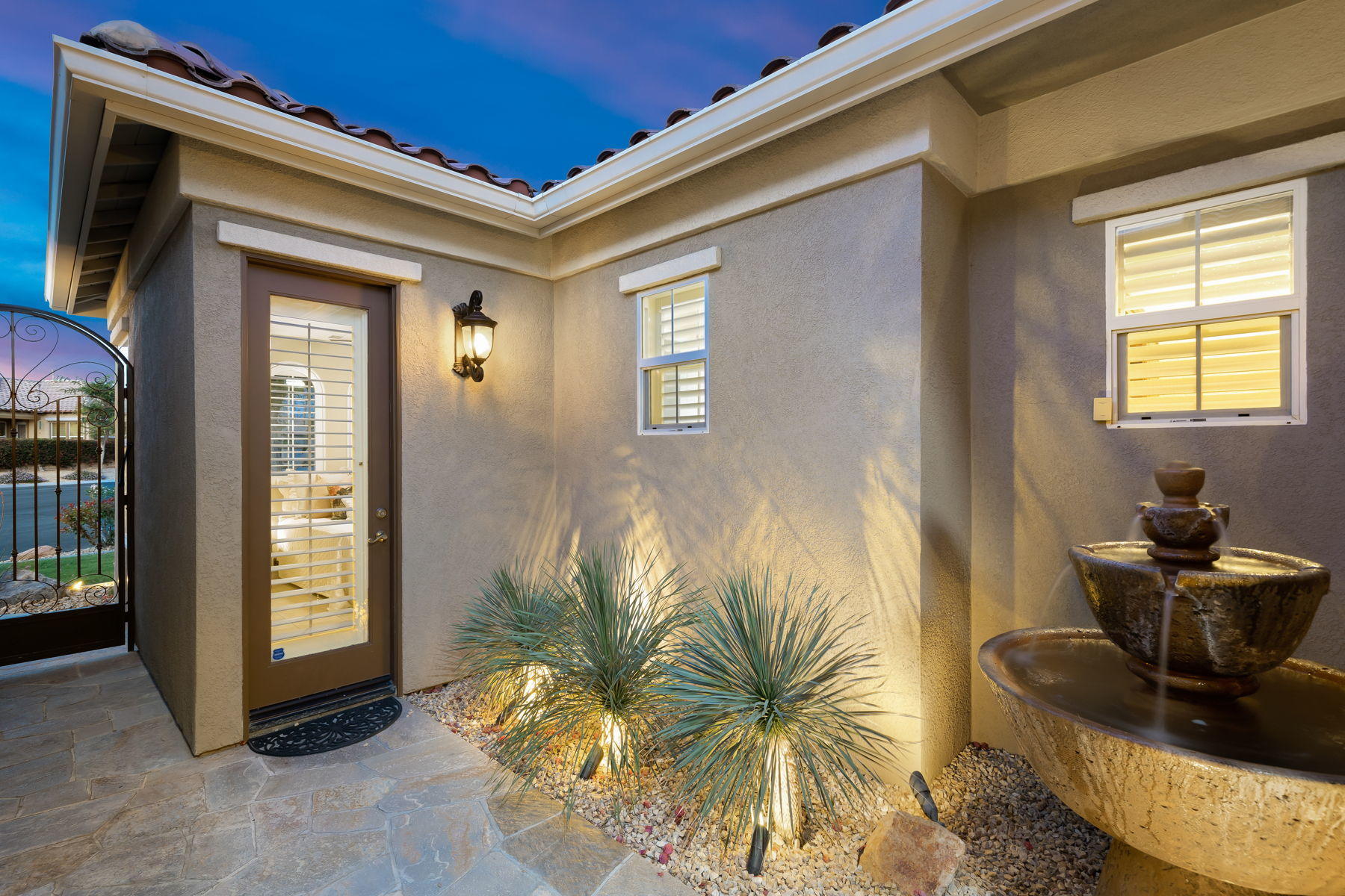 3 Pyramid Lake Court Rancho Mirage, CA 92270 - Photo 6 of 40 a living room with furniture and a potted plant
