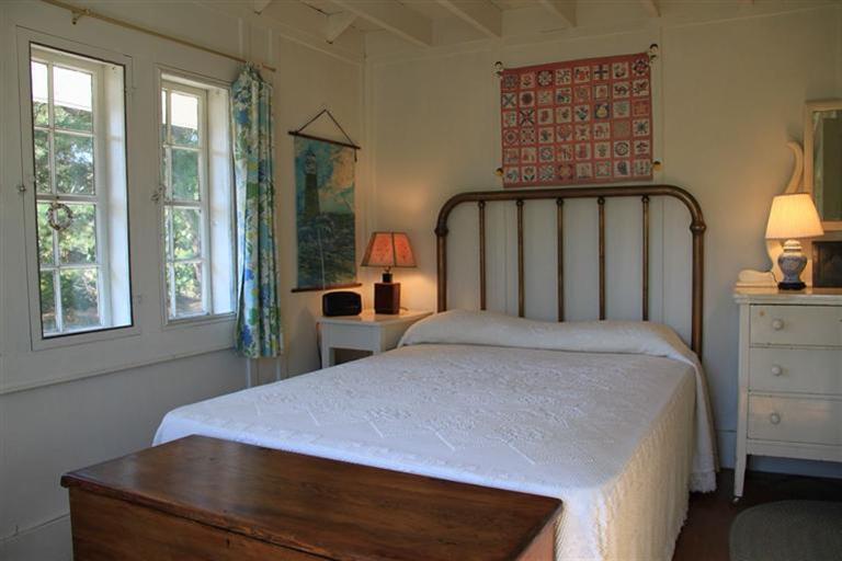 4 Franz Road Orleans, MA 02653 - Photo 13 of 30 a bed sitting in a bedroom next to a window