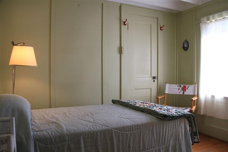 4 Franz Road Orleans, MA 02653 - Photo 14 of 30 a bedroom with a bed and a mirror