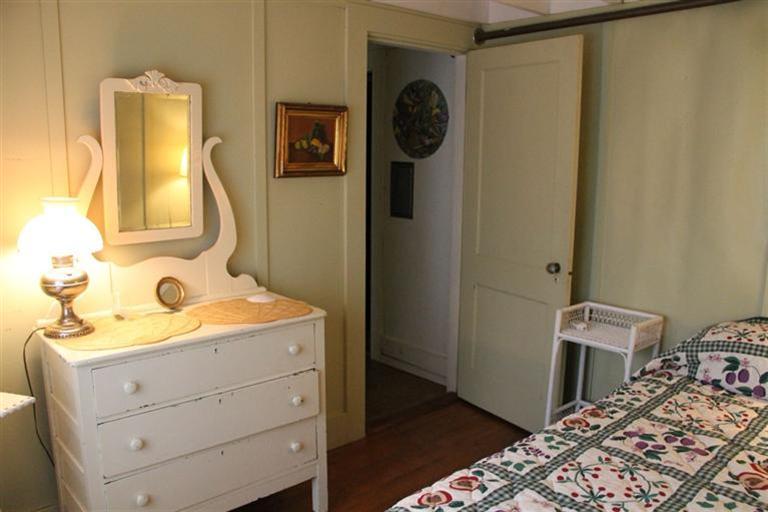 4 Franz Road Orleans, MA 02653 - Photo 15 of 30 a bedroom with a bed and a mirror