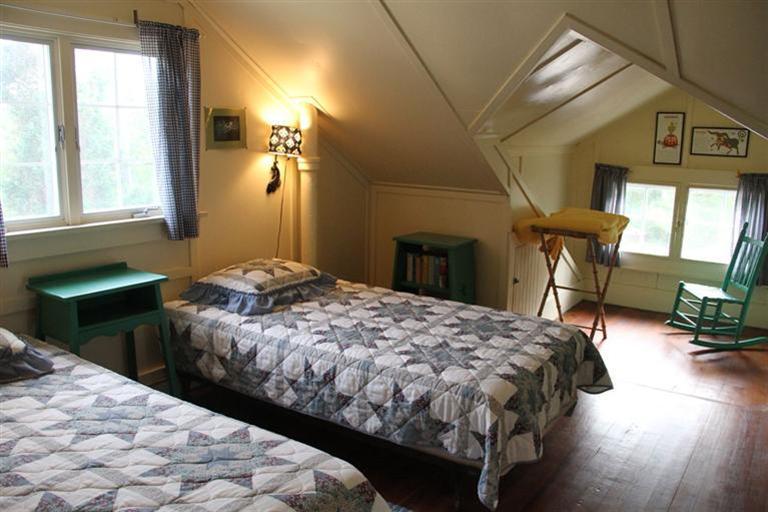 4 Franz Road Orleans, MA 02653 - Photo 17 of 30 a bedroom with a bed a table and chair