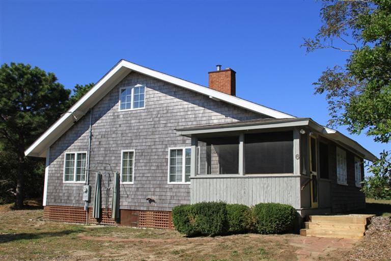 4 Franz Road Orleans, MA 02653 - Photo 4 of 30 a front view of a house with a yard
