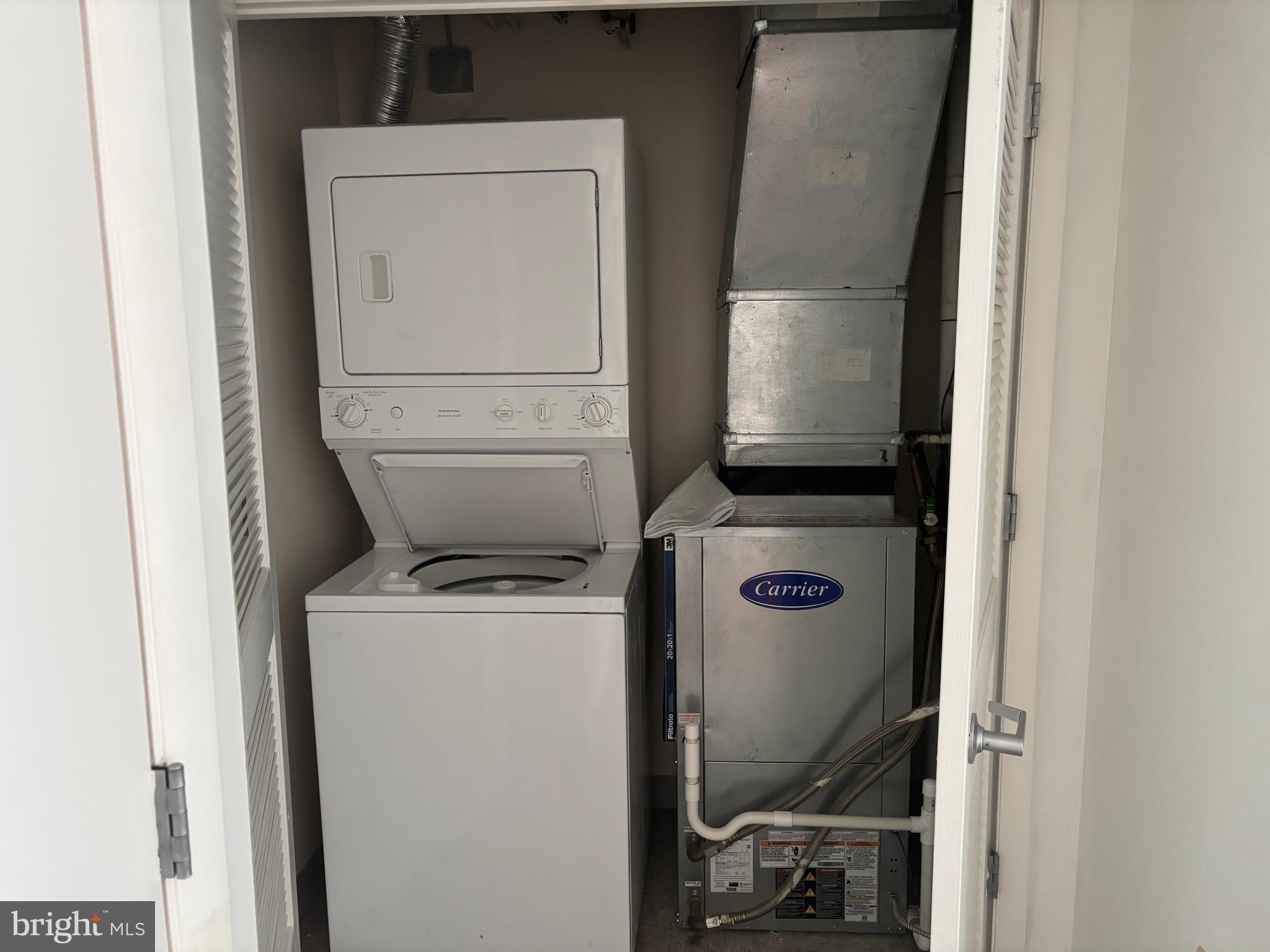 1150 K Street Northwest, Unit 1107 Washington, DC 20005 - Photo 12 of 20 a utility room with dryer and washer