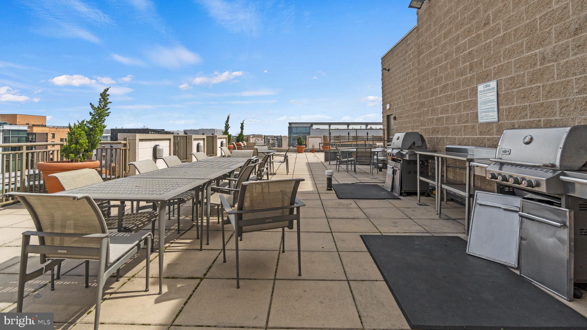 1150 K Street Northwest, Unit 1107 Washington, DC 20005 - Photo 16 of 20 a view of a dining space with furniture and outside view