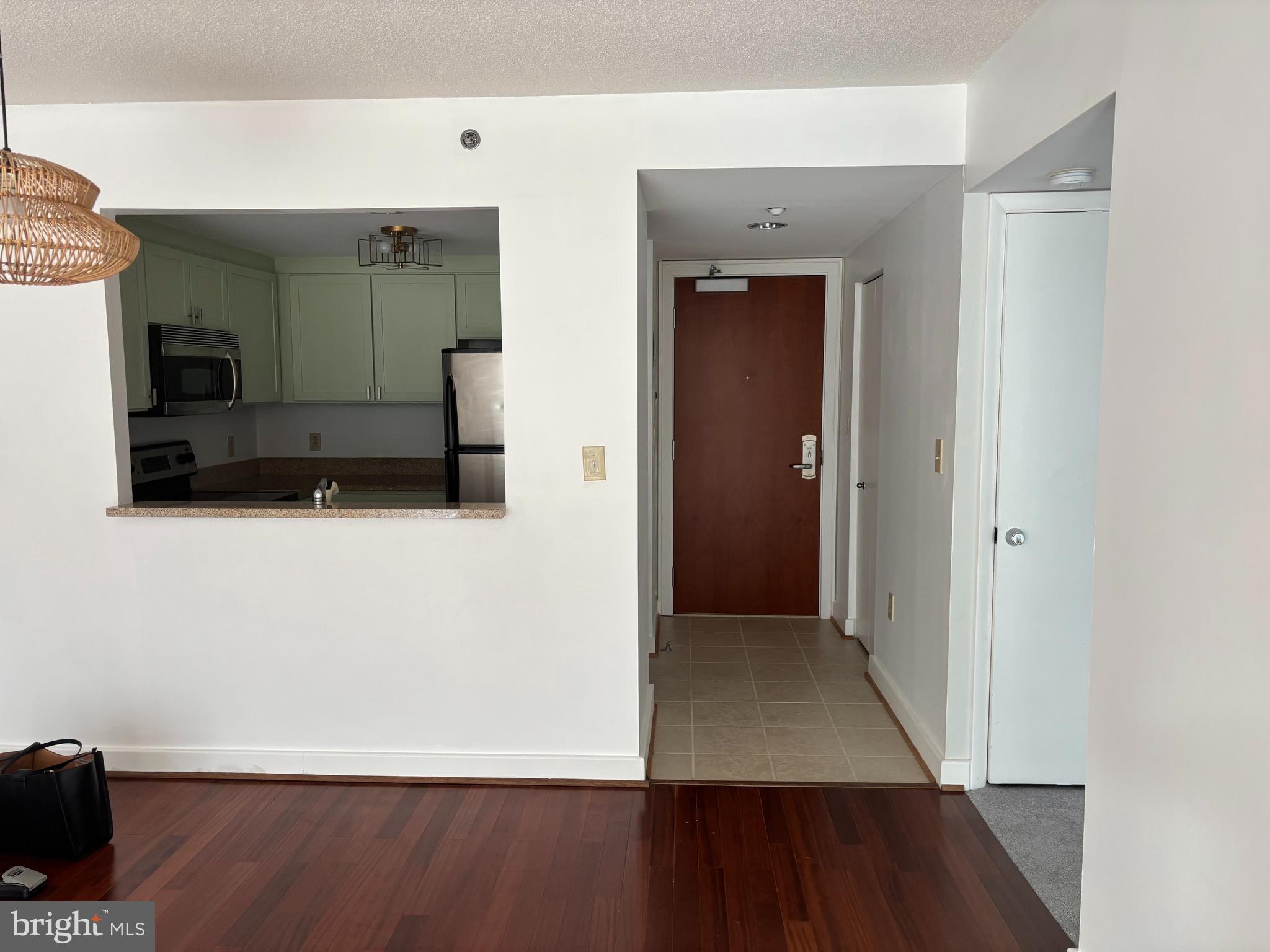 1150 K Street Northwest, Unit 1107 Washington, DC 20005 - Photo 8 of 20 wooden floor in an empty room