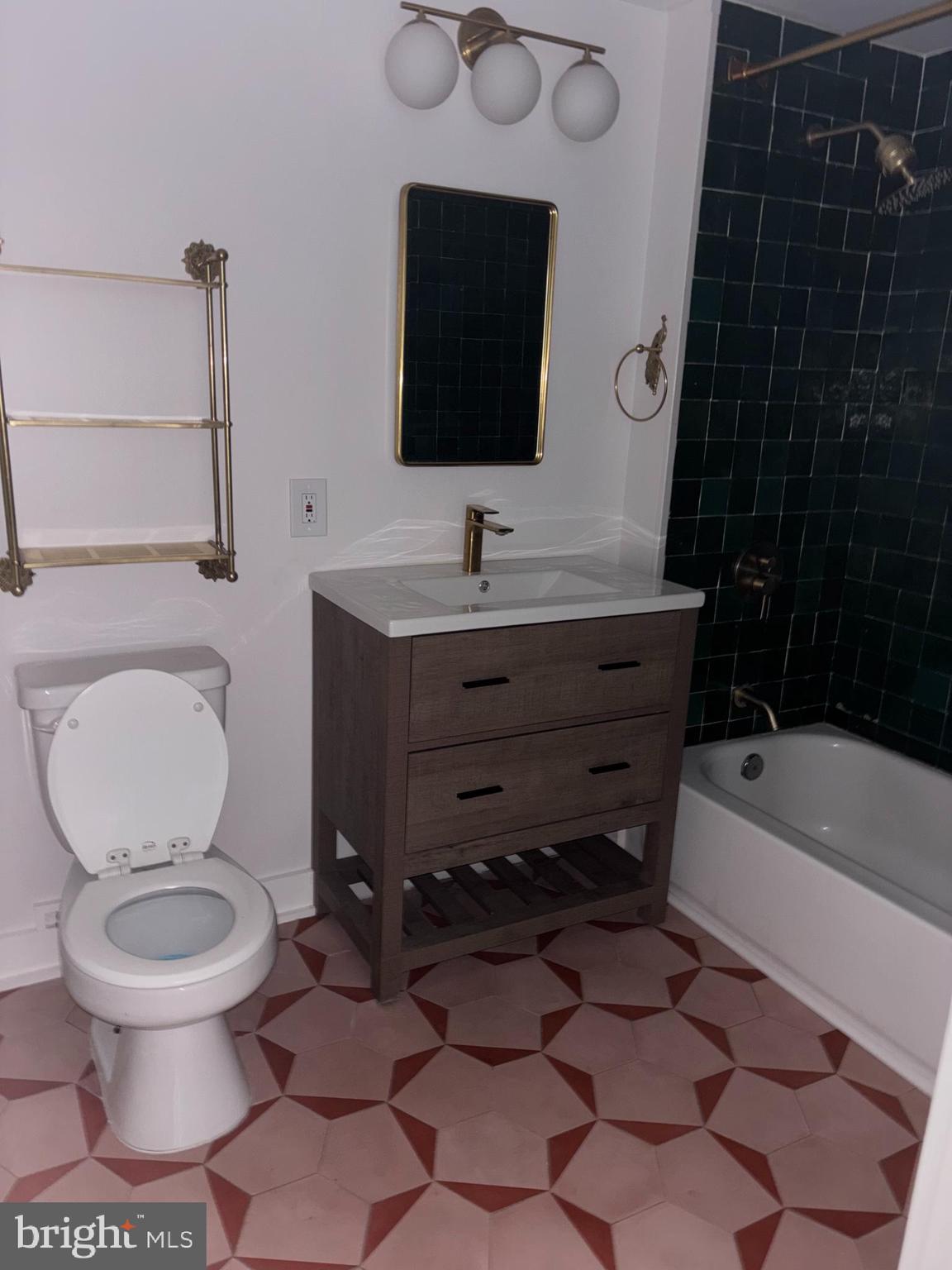 1150 K Street Northwest, Unit 1107 Washington, DC 20005 - Photo 9 of 20 a bathroom with a toilet a sink and bathtub