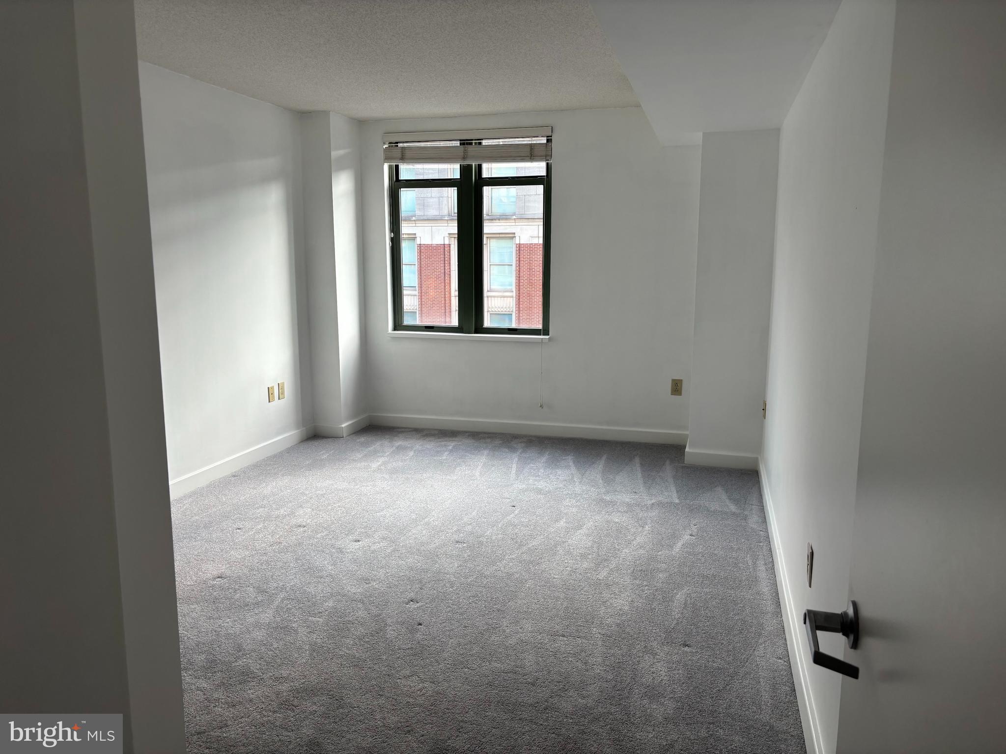 1150 K Street Northwest, Unit 1107 Washington, DC 20005 - Photo 10 of 20 an empty room with windows
