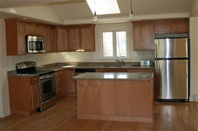 126 Long Road Harwich, MA 02645 - Photo 3 of 8 a kitchen with a refrigerator sink and cabinets