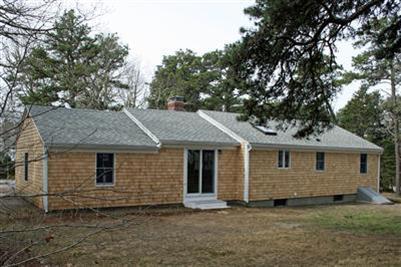 126 Long Road Harwich, MA 02645 - Photo 7 of 8 a front view of a house with a garden