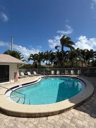 a view of a swimming pool with a chairs