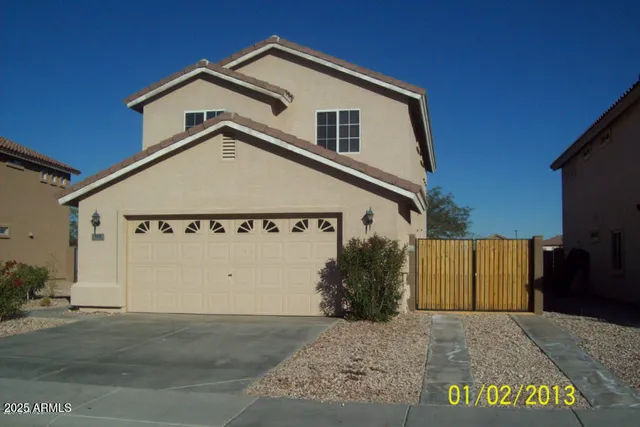 a view of a house with a garage