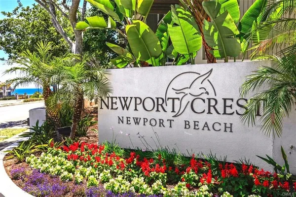 a sign that is in front of flowers