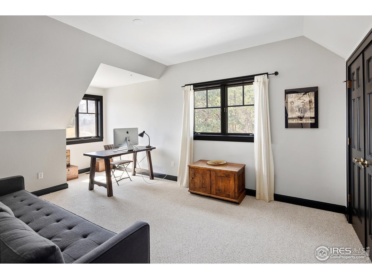 8558 Flagstaff Road Boulder, CO 80302 - Photo 12 of 50 a living room with furniture and a window