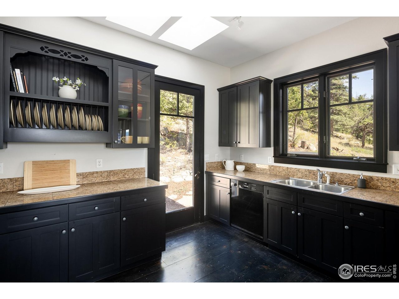 8558 Flagstaff Road Boulder, CO 80302 - Photo 20 of 50 a kitchen with stainless steel appliances granite countertop a sink a stove and a microwave