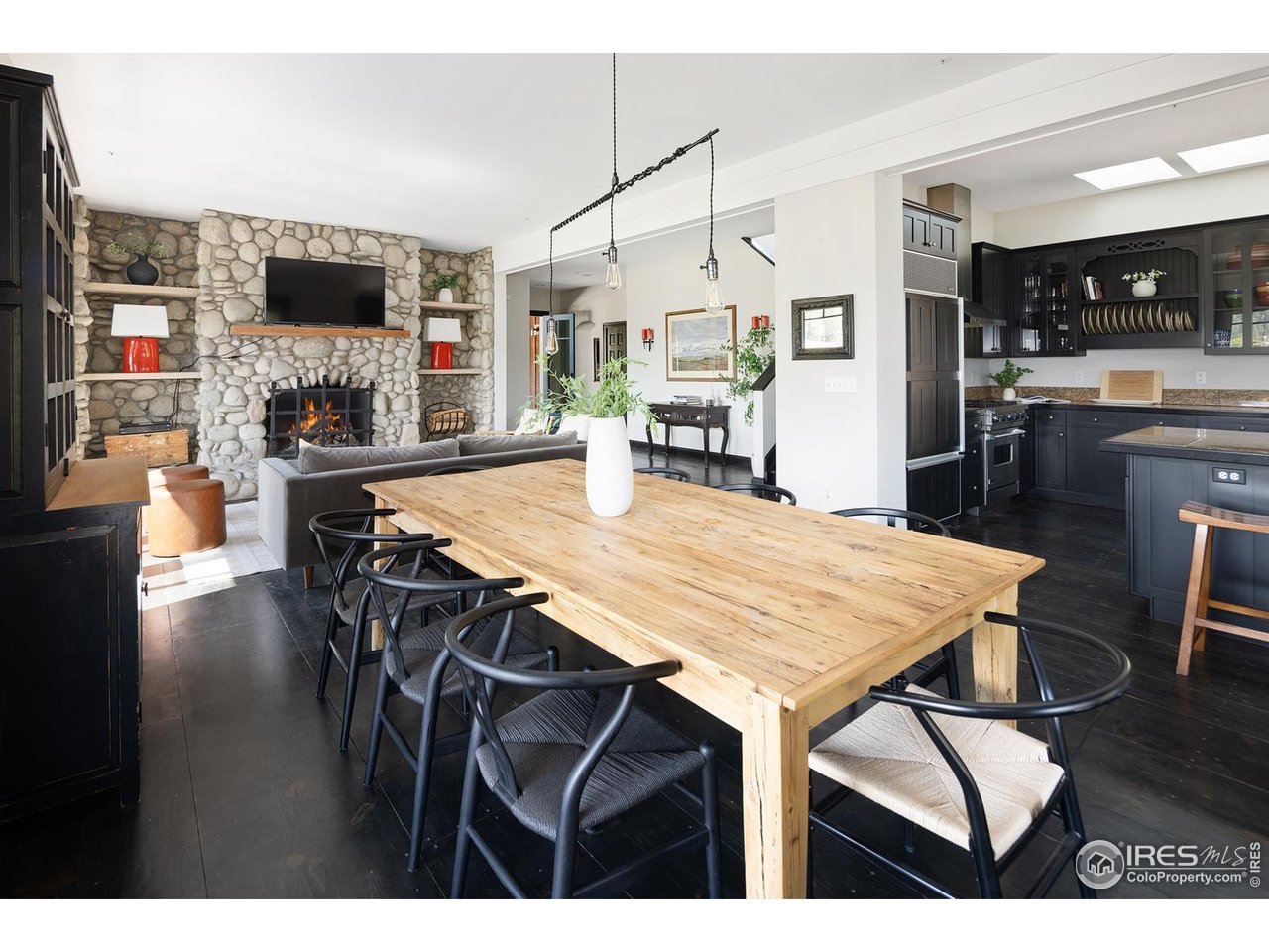 8558 Flagstaff Road Boulder, CO 80302 - Photo 22 of 50 a view of a dining room with furniture and wooden floor
