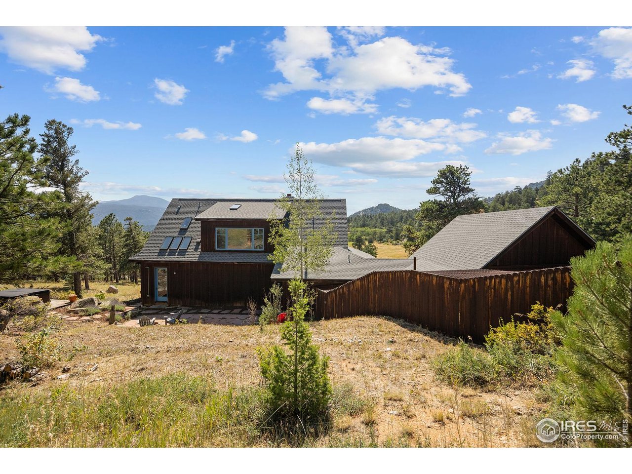 8558 Flagstaff Road Boulder, CO 80302 - Photo 27 of 50 a view of a couches in the patio and a yard