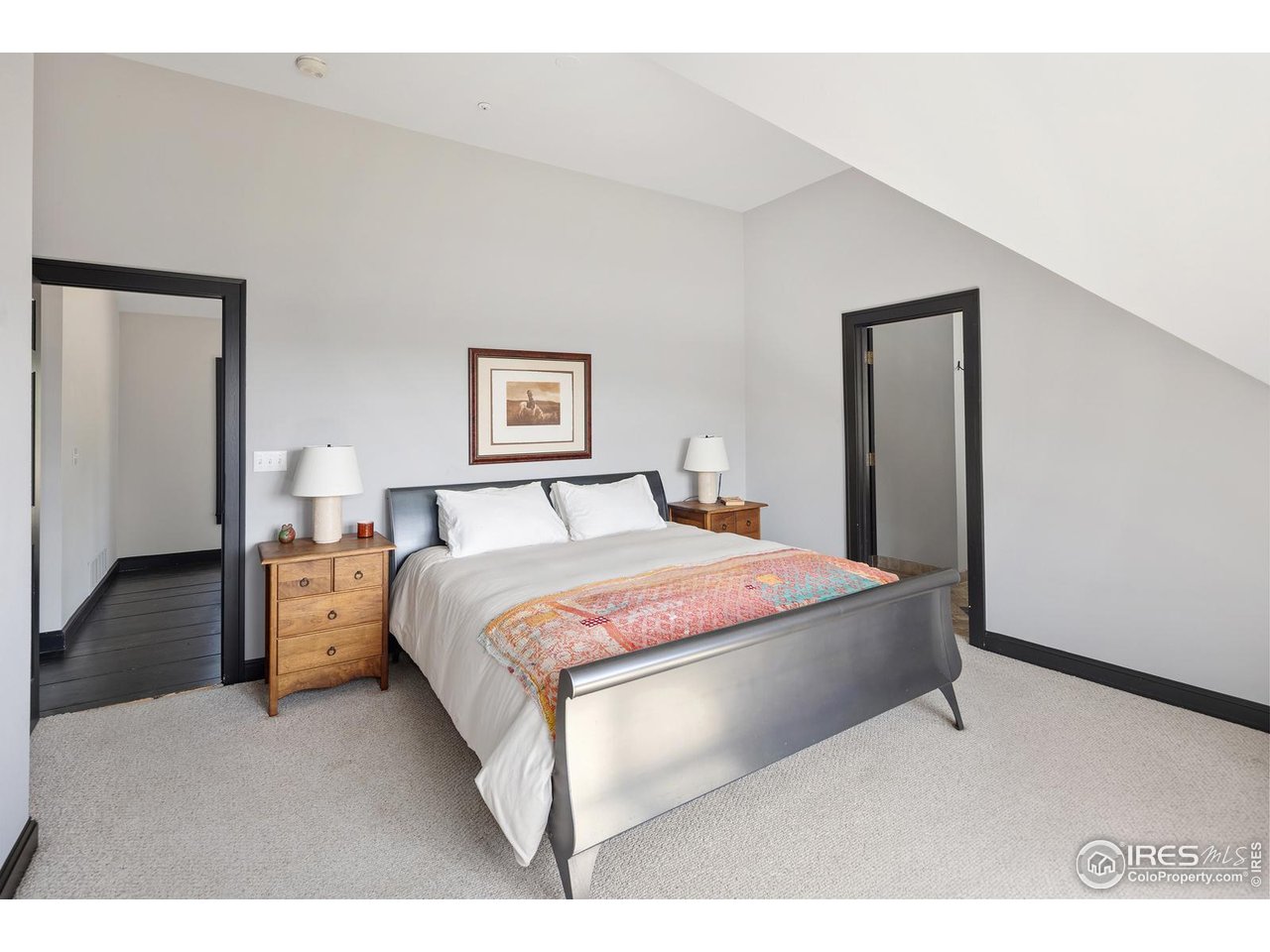 8558 Flagstaff Road Boulder, CO 80302 - Photo 31 of 50 a bedroom with a bed and a view of bathroom