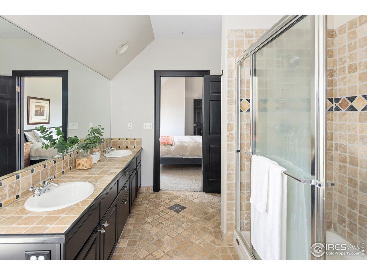 8558 Flagstaff Road Boulder, CO 80302 - Photo 34 of 50 a en suite bathroom with a sink double vanity and shower