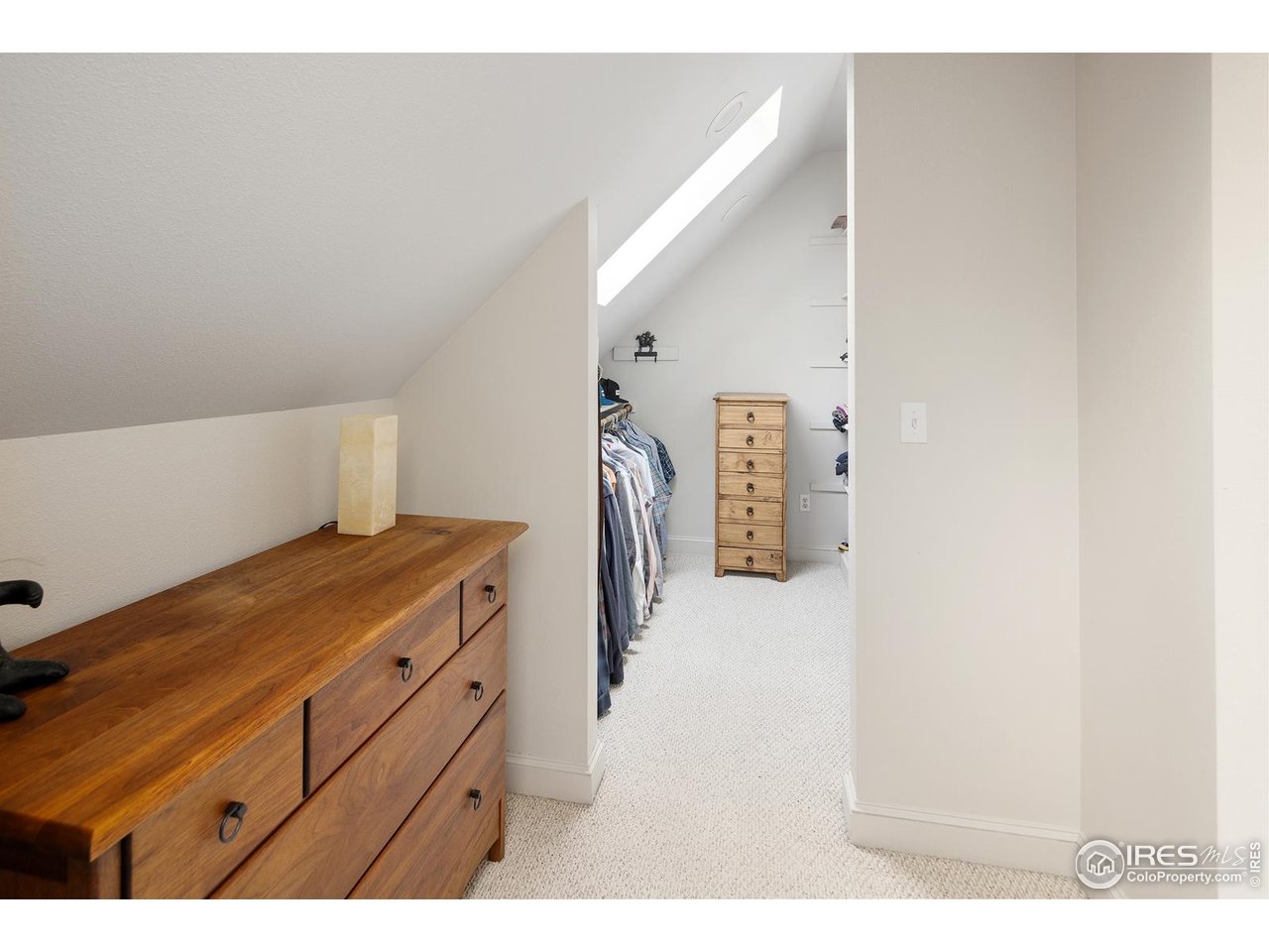 8558 Flagstaff Road Boulder, CO 80302 - Photo 36 of 50 a hallway with a dresser and a window