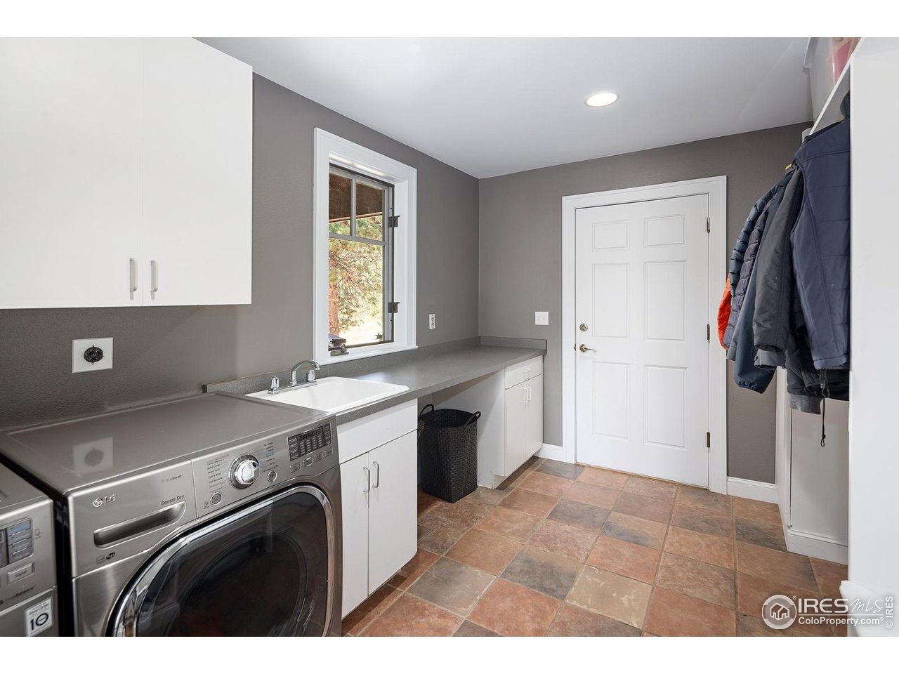 8558 Flagstaff Road Boulder, CO 80302 - Photo 39 of 50 a view of a kitchen with fridge and wooden floor