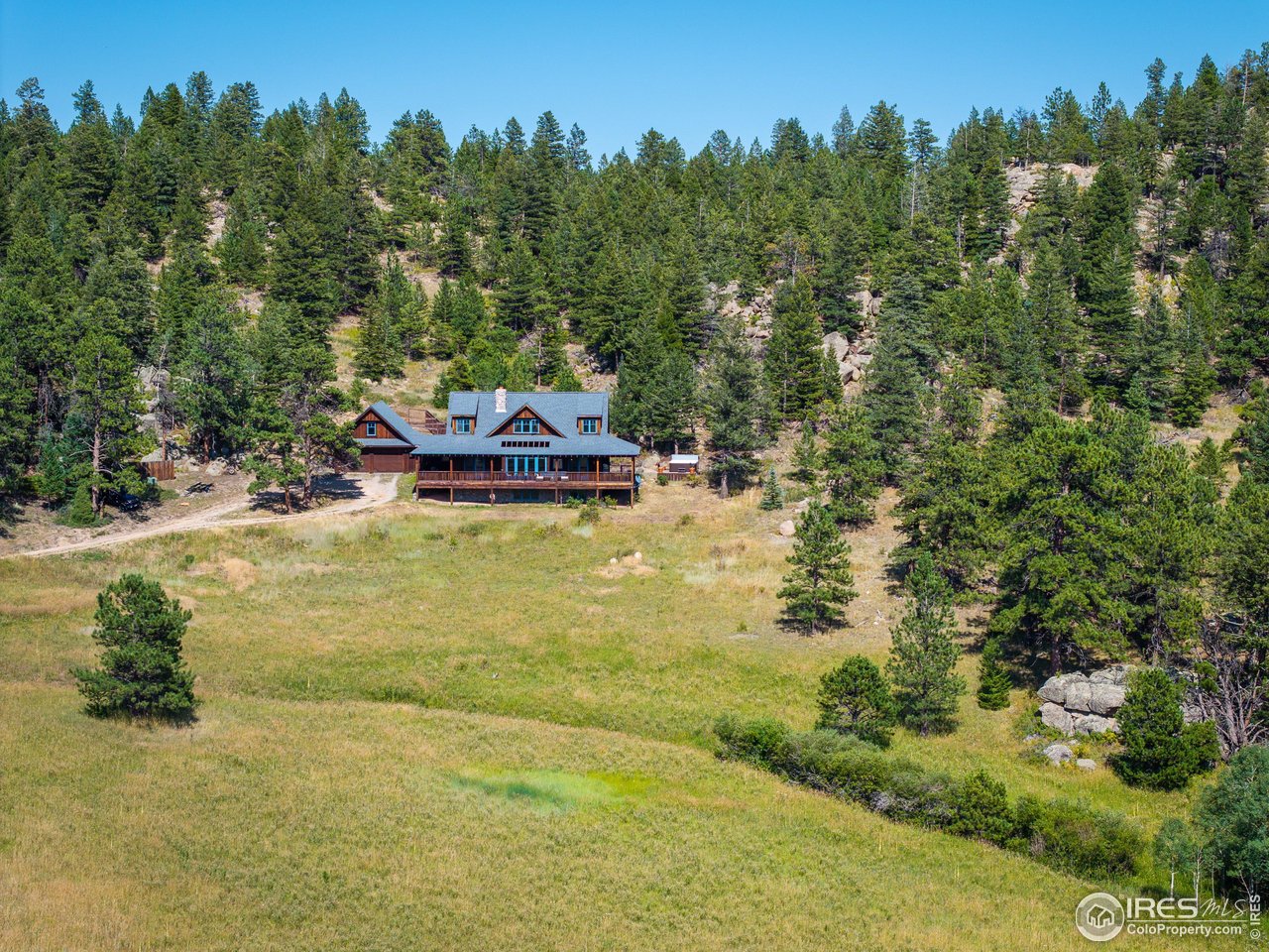 8558 Flagstaff Road Boulder, CO 80302 - Photo 4 of 50 a view of a swimming pool with an outdoor space and seating area