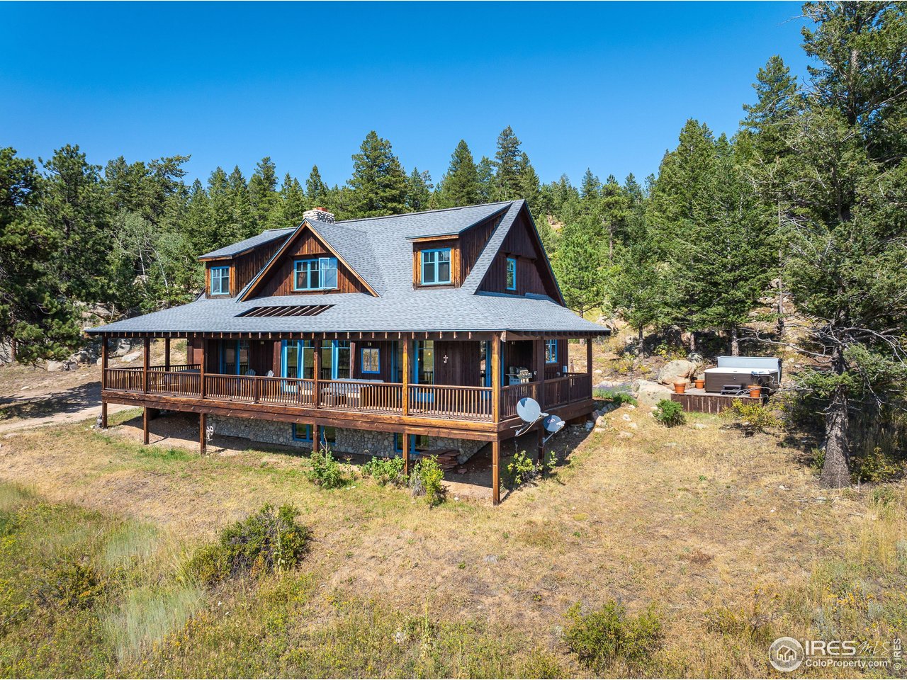 8558 Flagstaff Road Boulder, CO 80302 - Photo 44 of 50 a front view of a house with a yard