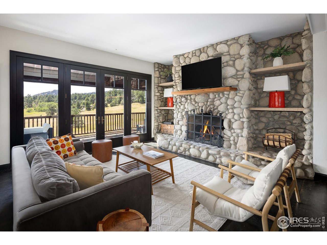 8558 Flagstaff Road Boulder, CO 80302 - Photo 6 of 50 a living room with furniture fireplace and flat screen tv