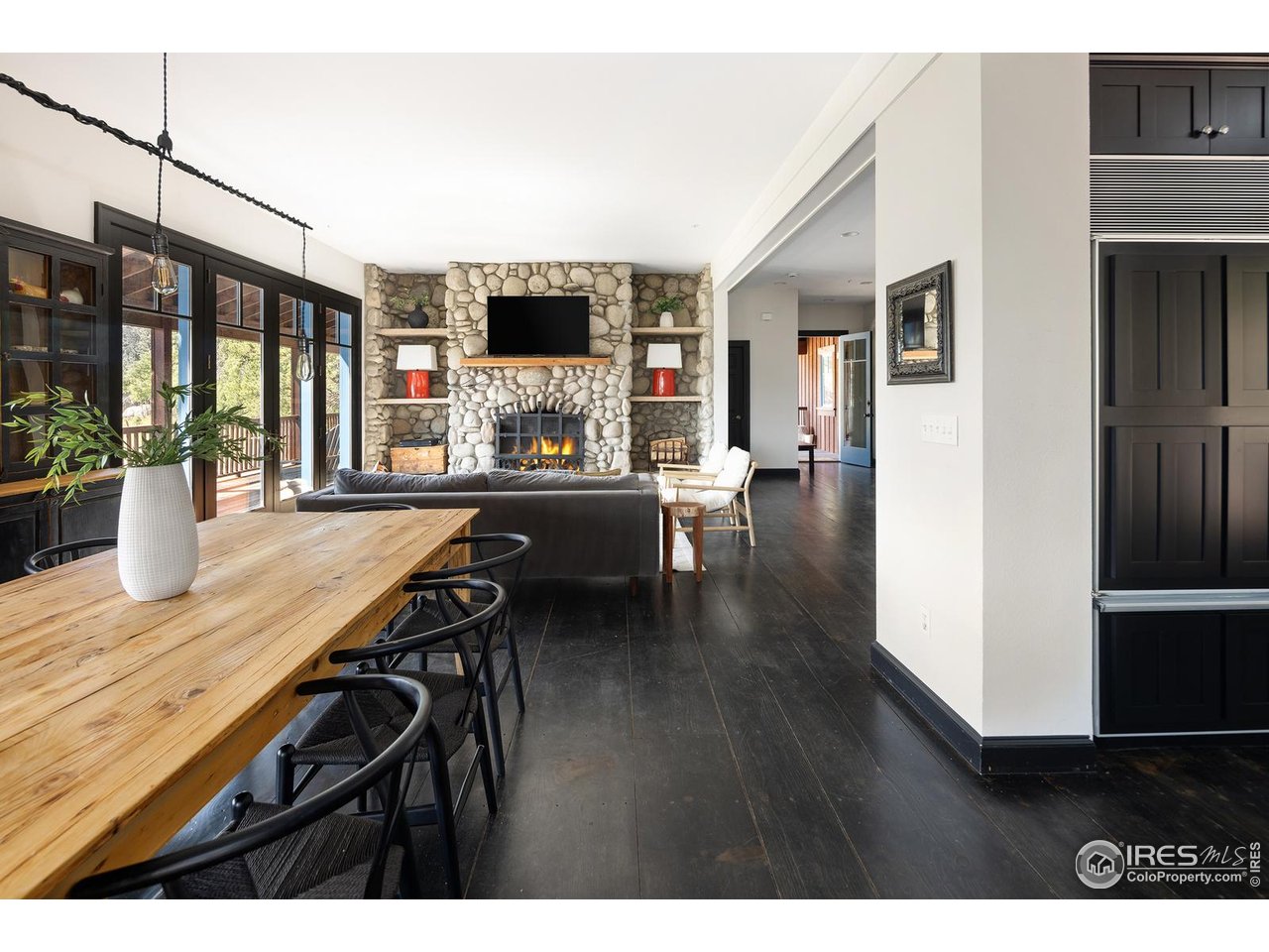 8558 Flagstaff Road Boulder, CO 80302 - Photo 7 of 50 a view of a dining room with furniture window and wooden floor