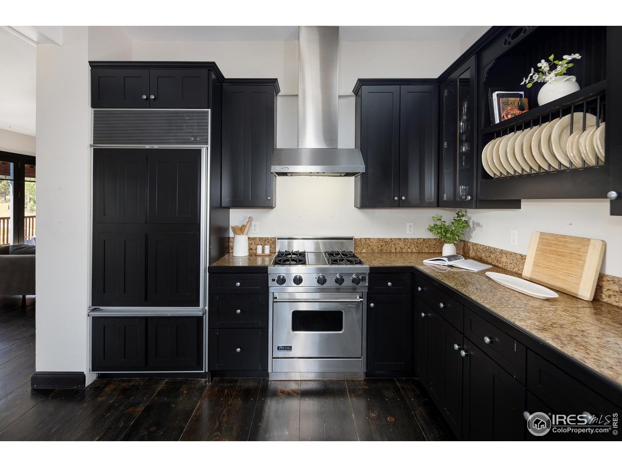 8558 Flagstaff Road Boulder, CO 80302 - Photo 8 of 50 a kitchen with stainless steel appliances granite countertop a stove a refrigerator and a microwave