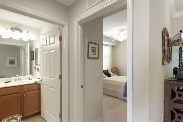 a en suite bathroom with a sink double vanity and a mirror