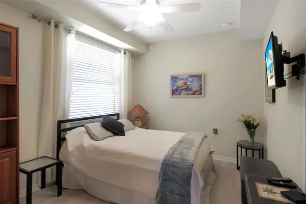 a bedroom with a bed and a window