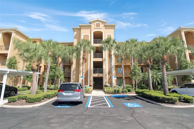 a car parked in front of a brick building