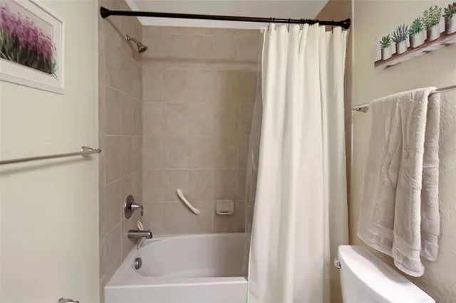 a close up of a bathtub curtain