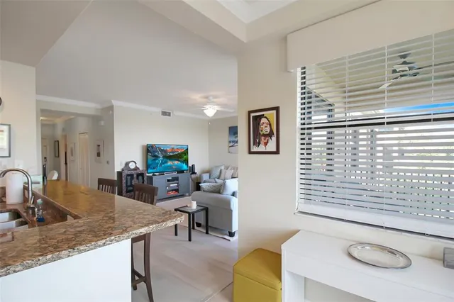 a view of a balcony with chair and floor to ceiling window