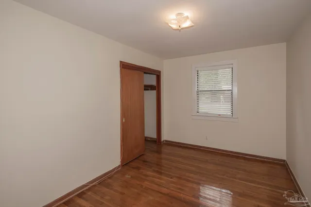 a bathroom with a sink a toilet and shower curtain