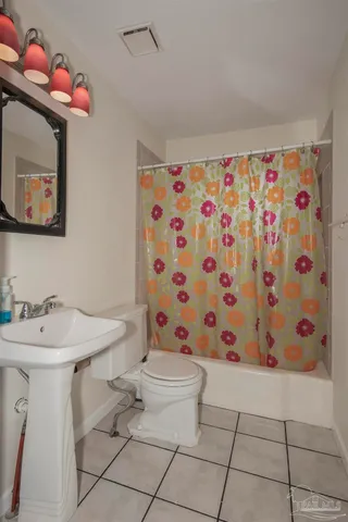 a bathroom with a sink mirror and vanity