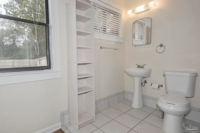 a bathroom with a toilet and a sink