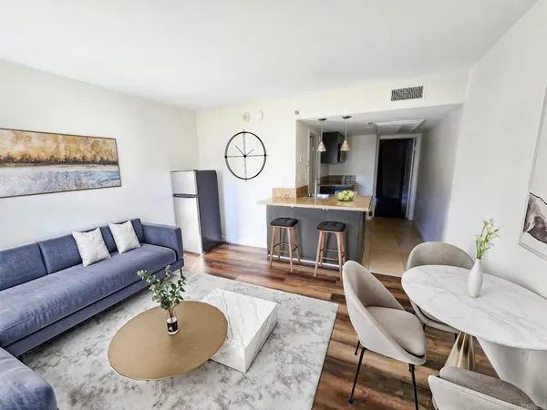 a living room with furniture and a table