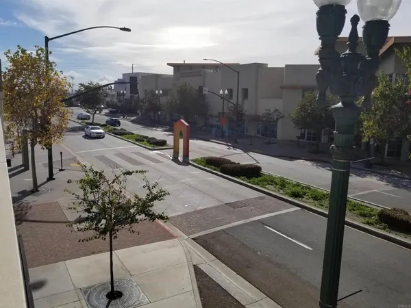 a view of a street with a building in the background