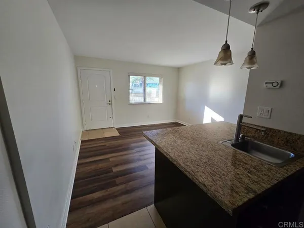 a kitchen with granite countertop a sink dishwasher and granite counter tops