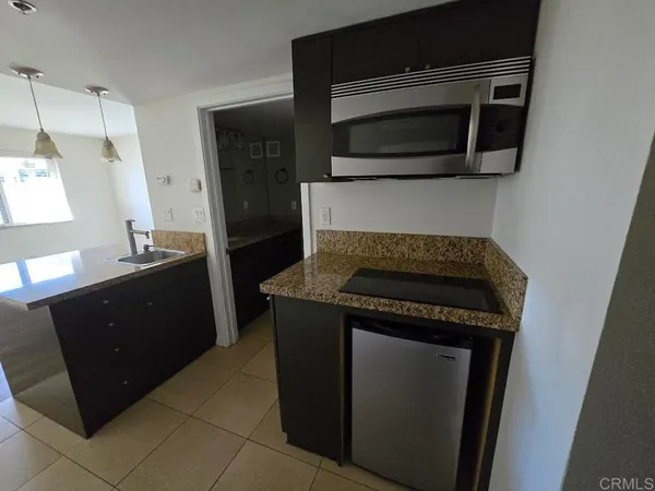 a kitchen with a stove and a microwave