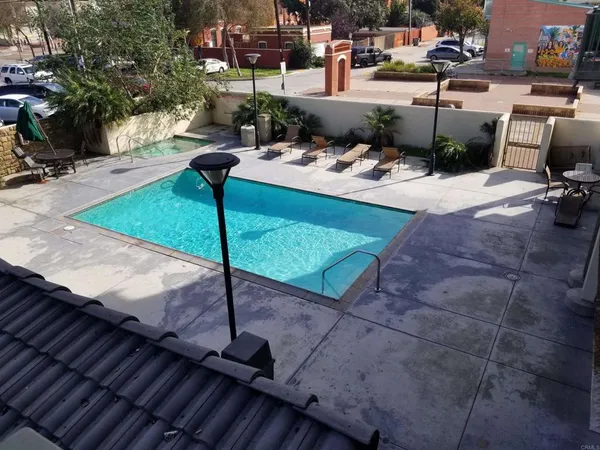 a view of a backyard with sitting area